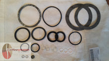 Laden Sie das Bild in den Galerie-Viewer, La Pavoni gasket set replacement with various rubber and metal gaskets laid out on a white cloth
